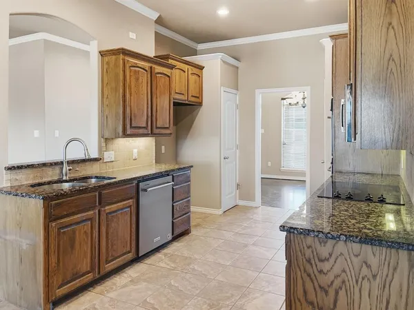 a stove top oven sitting inside of a kitchen