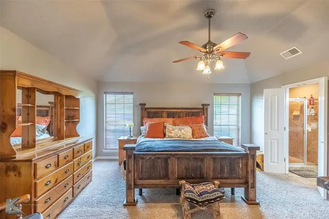 a view of a dining room with furniture a chandelier and wooden floor