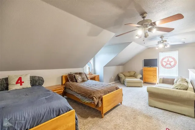 a bedroom with furniture and a chandelier