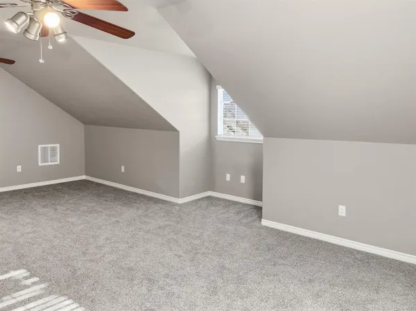 a view of a chairs and table in patio with a backyard