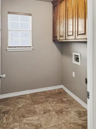 a view of a patio with a dining table and chairs