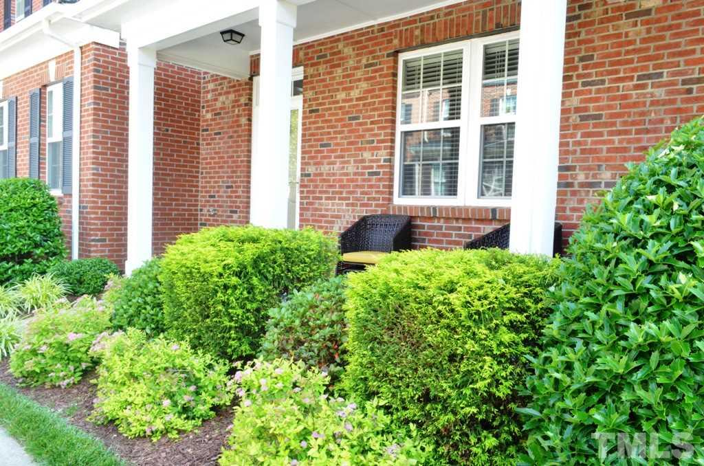 509 Dragby Lane Raleigh, NC 27603 - Photo 2 of 25 a view of house with backyard and a garden