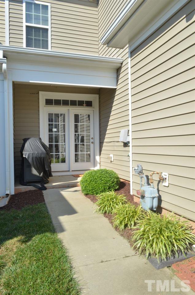509 Dragby Lane Raleigh, NC 27603 - Photo 12 of 25 a front view of a house with a yard and outdoor seating