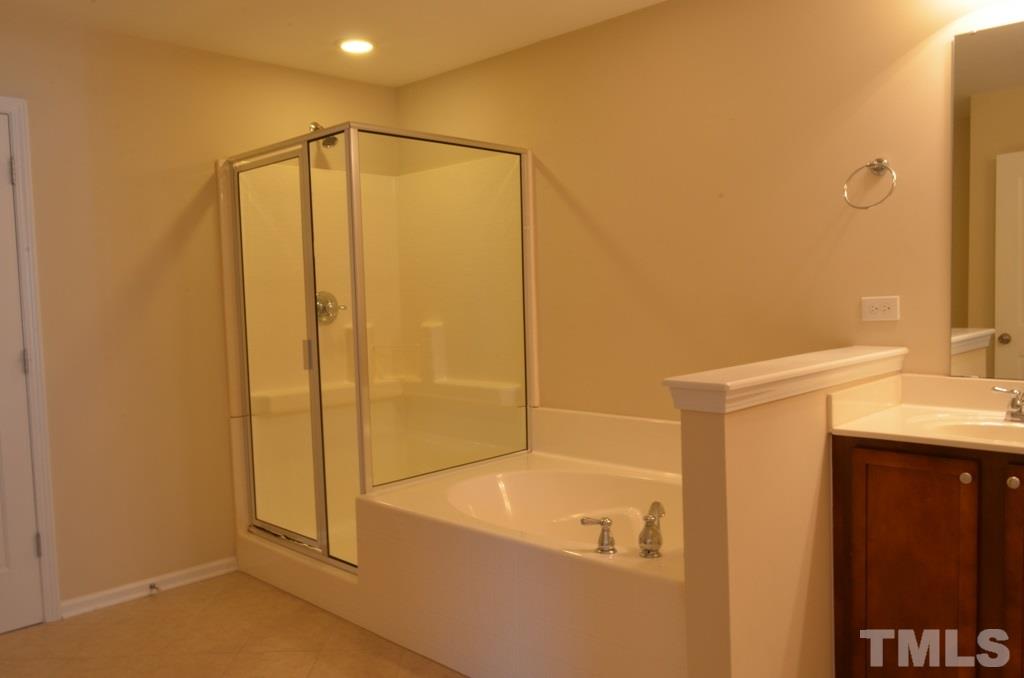 509 Dragby Lane Raleigh, NC 27603 - Photo 15 of 25 a bathroom with a shower and a sink