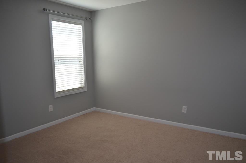 509 Dragby Lane Raleigh, NC 27603 - Photo 17 of 25 an empty room with a window
