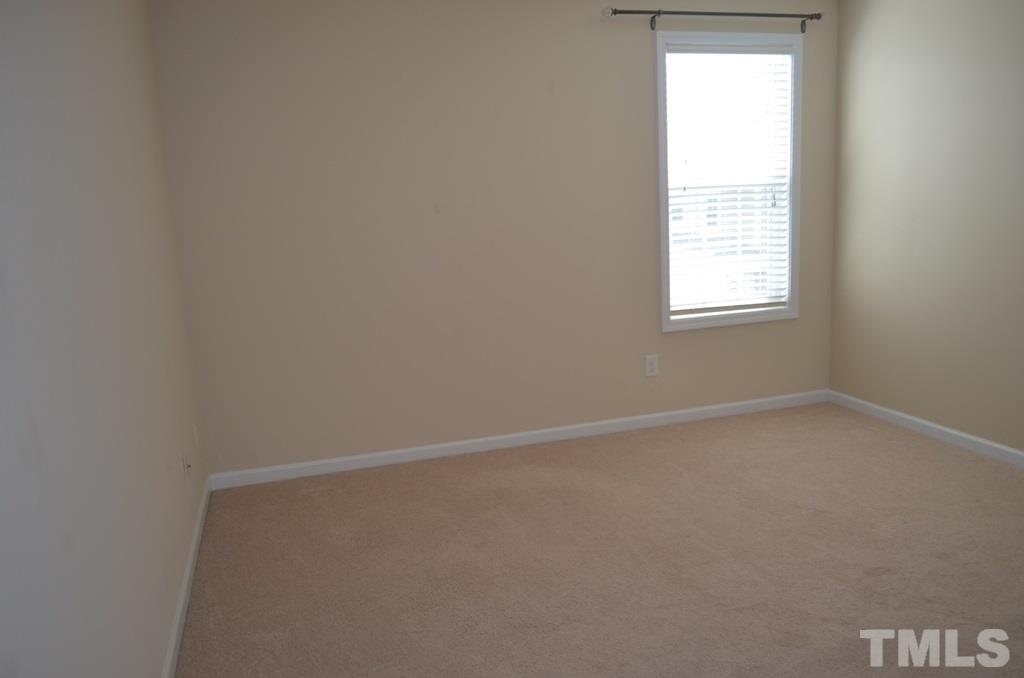 509 Dragby Lane Raleigh, NC 27603 - Photo 19 of 25 an empty room with a window