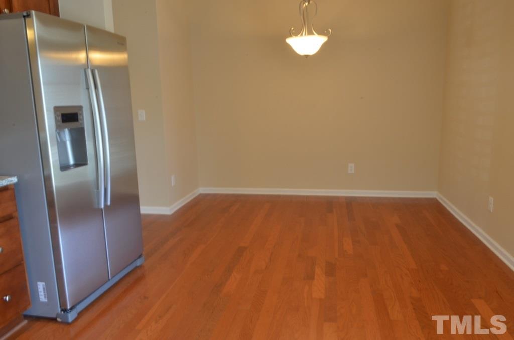 509 Dragby Lane Raleigh, NC 27603 - Photo 10 of 25 a view of empty room with wooden floor