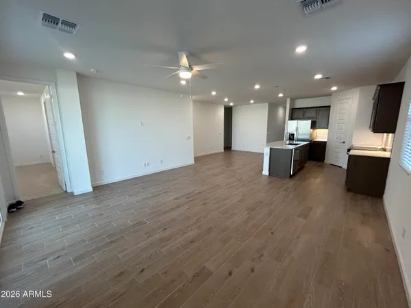 a view of kitchen with furniture and a refrigerator