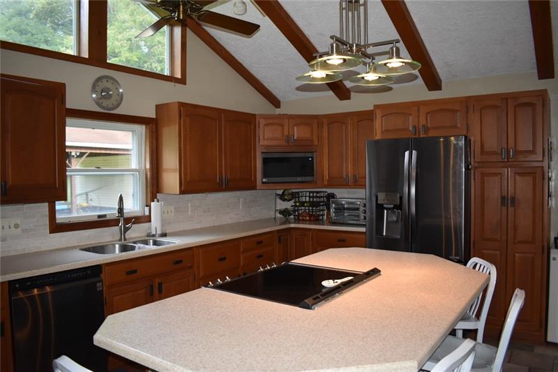 181 Baumgardner Road Salix, PA 15952 - Photo 7 of 24 Stainless steel appliances and elegant tile backsplash.