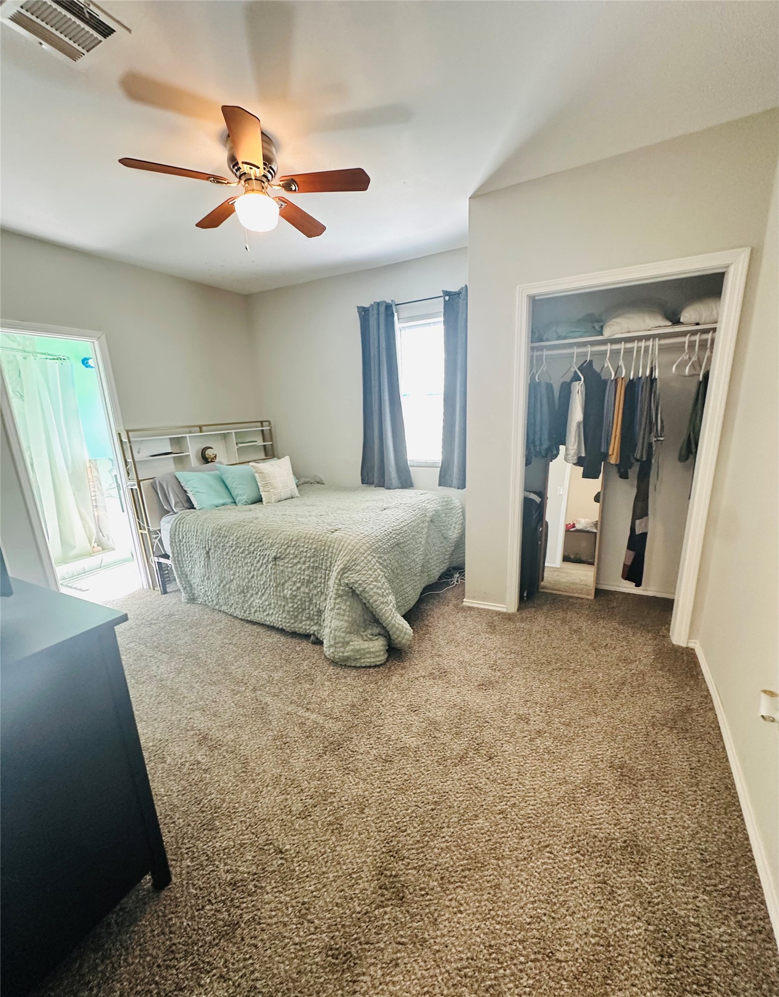 323 North Outlar Street Wharton, TX 77488 - Photo 11 of 25 a living room with a bed and furniture