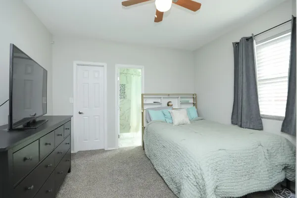 a bathroom with a shower curtain and a sink
