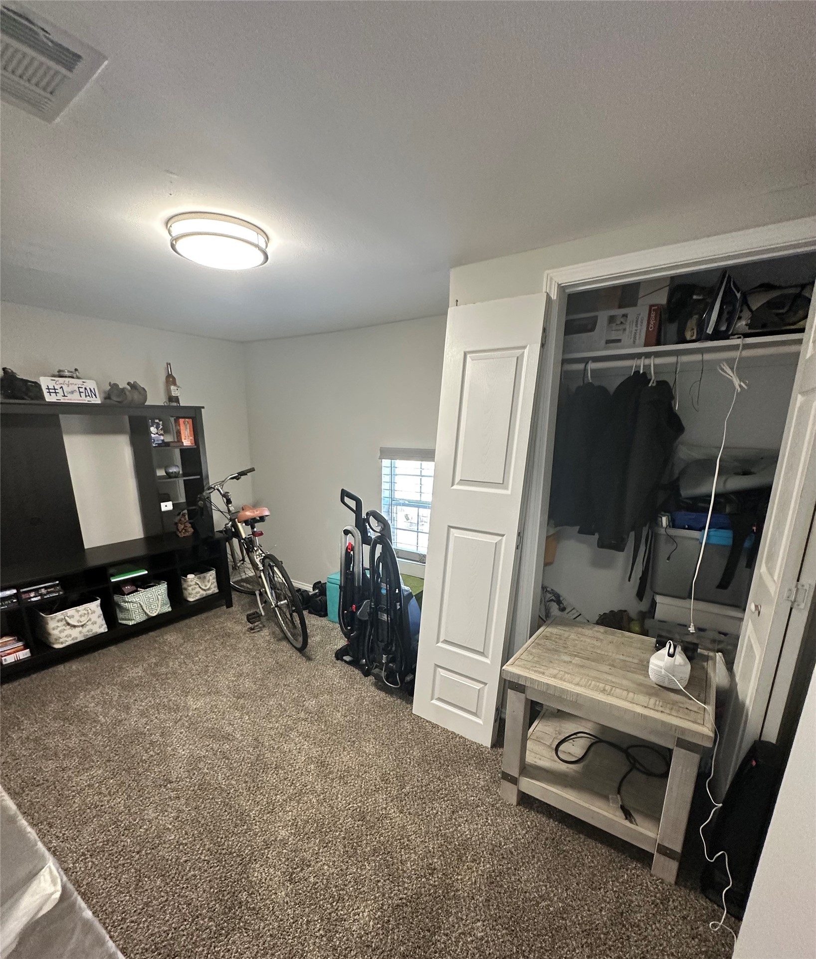 323 North Outlar Street Wharton, TX 77488 - Photo 19 of 25 a room with gym equipment and a mirror
