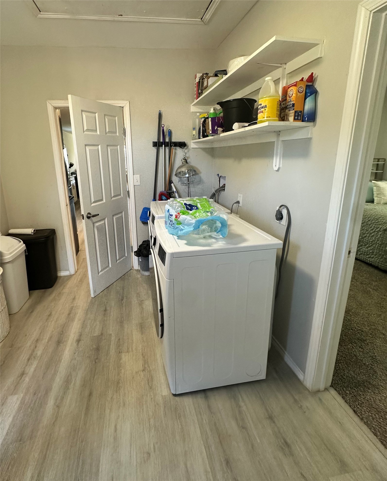 323 North Outlar Street Wharton, TX 77488 - Photo 20 of 25 a room with water heater and wooden cabinets