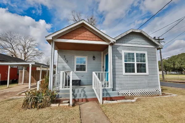 a front view of a house with a porch