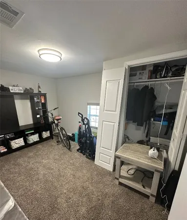 a utility room with dryer washer and a view of living area