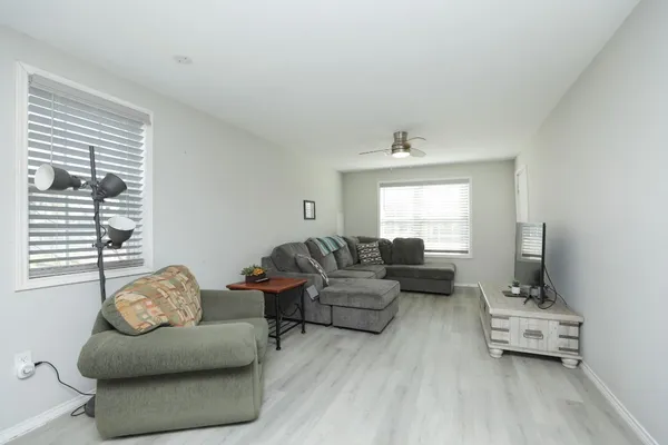 a living room with furniture and a window