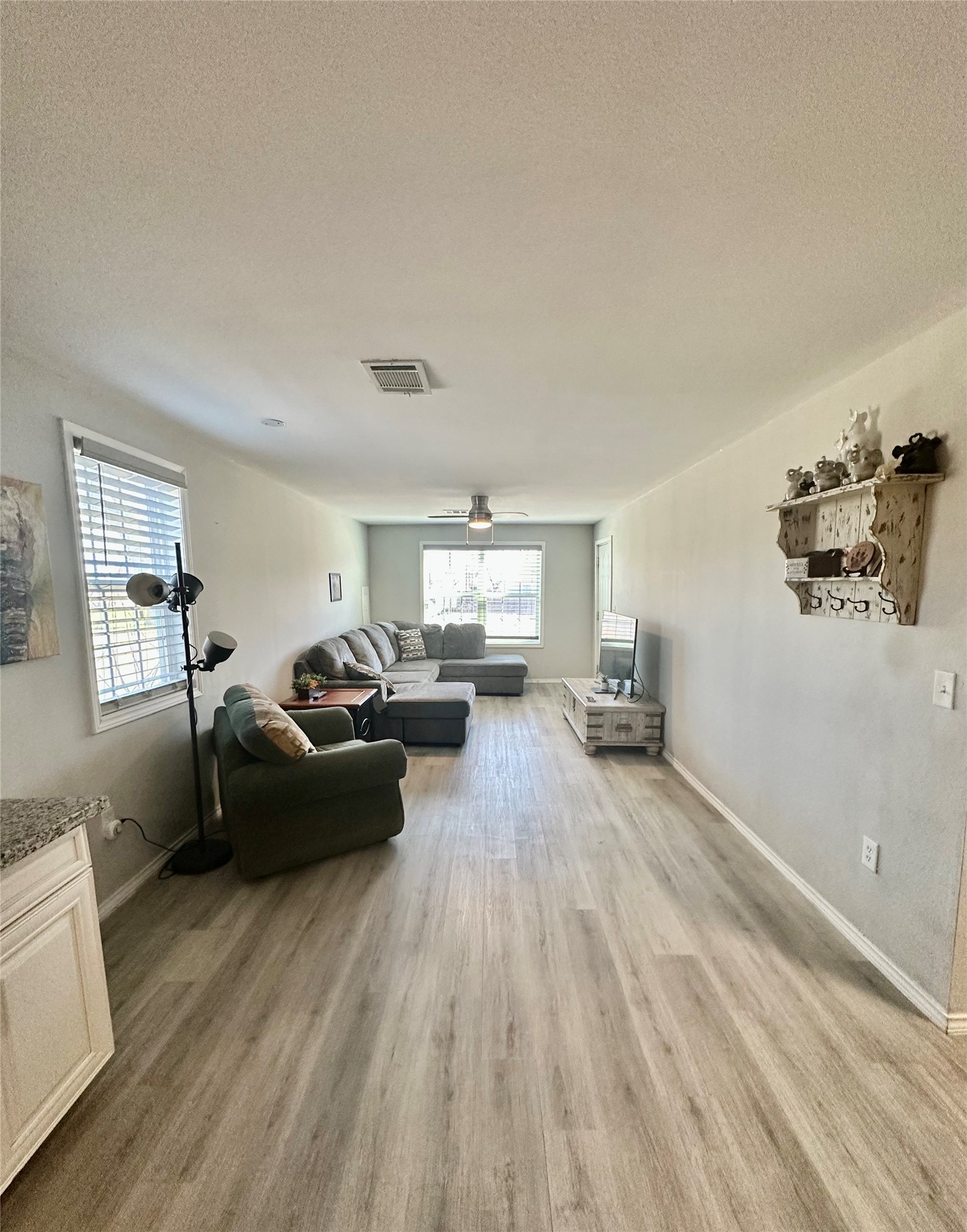 323 North Outlar Street Wharton, TX 77488 - Photo 8 of 25 a living room with furniture and a wooden floor