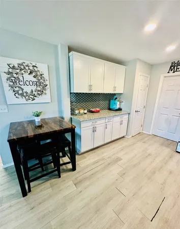 a kitchen with granite countertop cabinets and steel stainless steel appliances