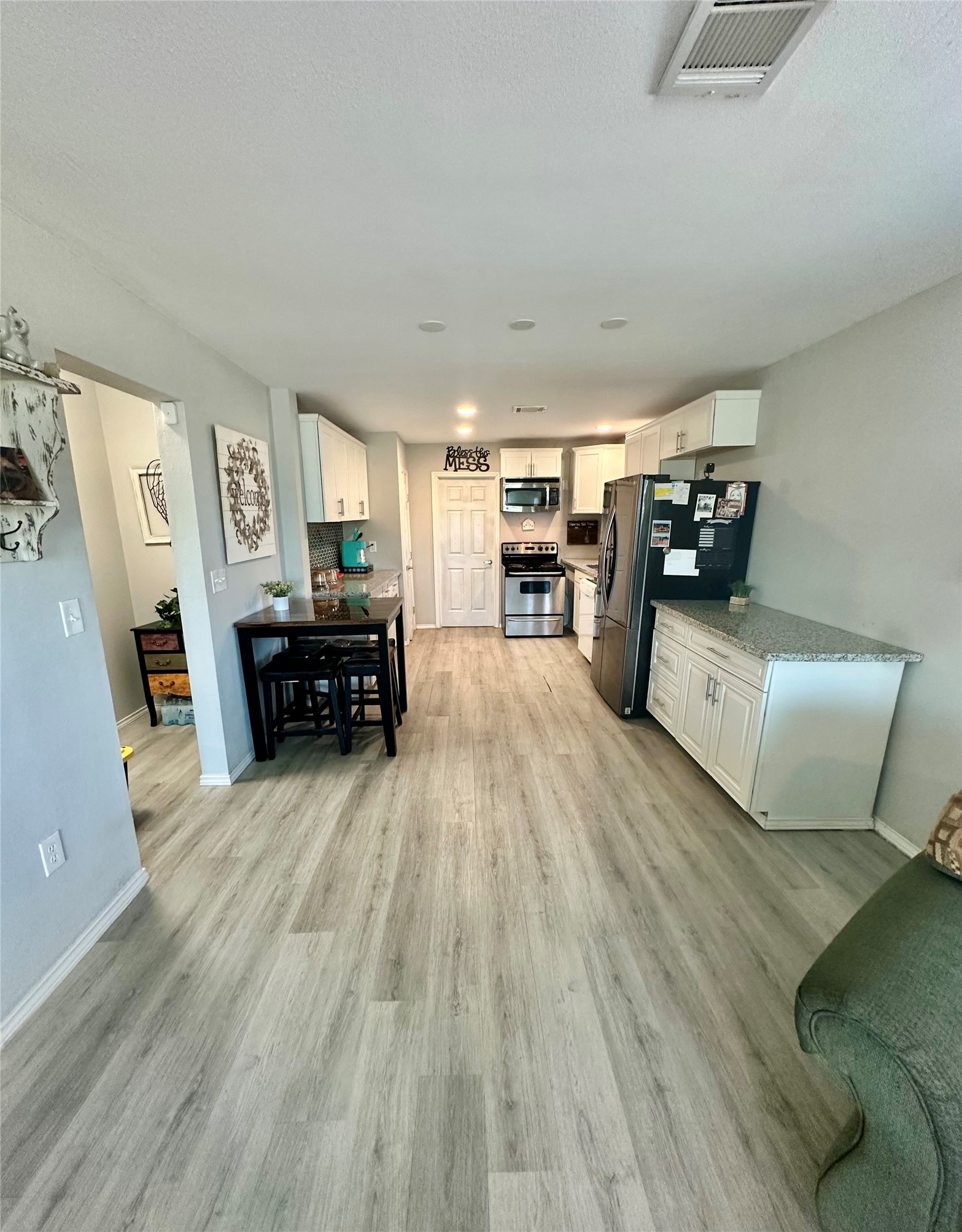 323 North Outlar Street Wharton, TX 77488 - Photo 10 of 25 a living room with furniture and a flat screen tv