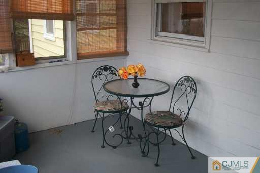 1257 Brookside Road Piscataway, NJ 08854 - Photo 2 of 8 a table and chairs in a room
