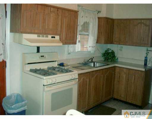 1257 Brookside Road Piscataway, NJ 08854 - Photo 8 of 8 a kitchen with a sink and cabinets