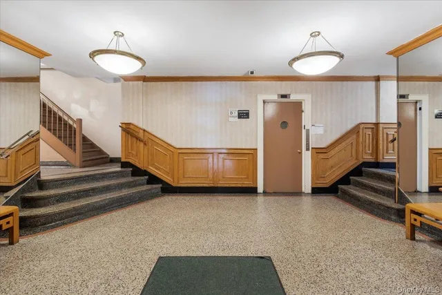 a view of an entryway with a workspace