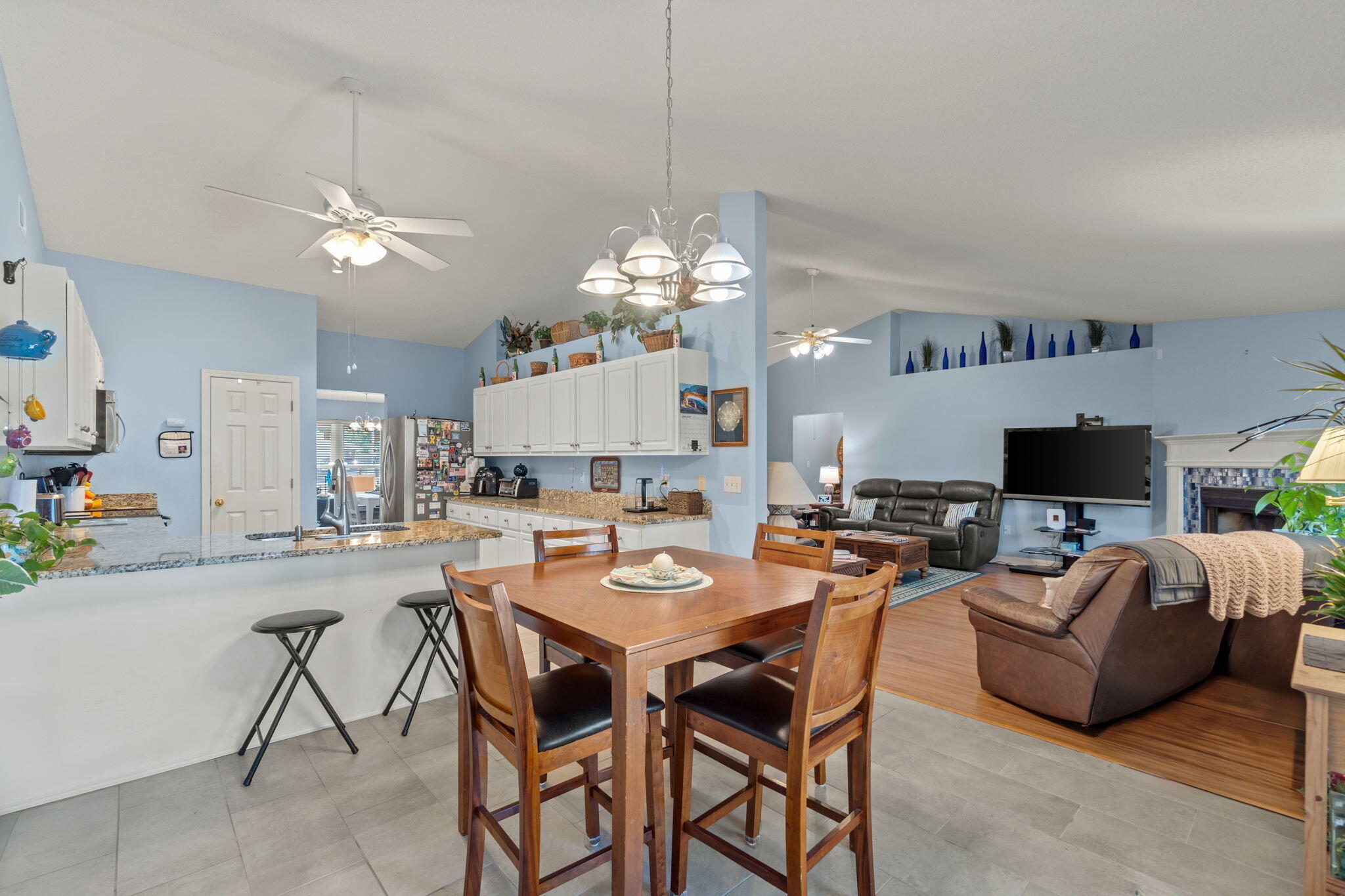 2121 Ortega Street Navarre, FL 32566 - Photo 12 of 47 a view of a dining room with furniture and a chandelier