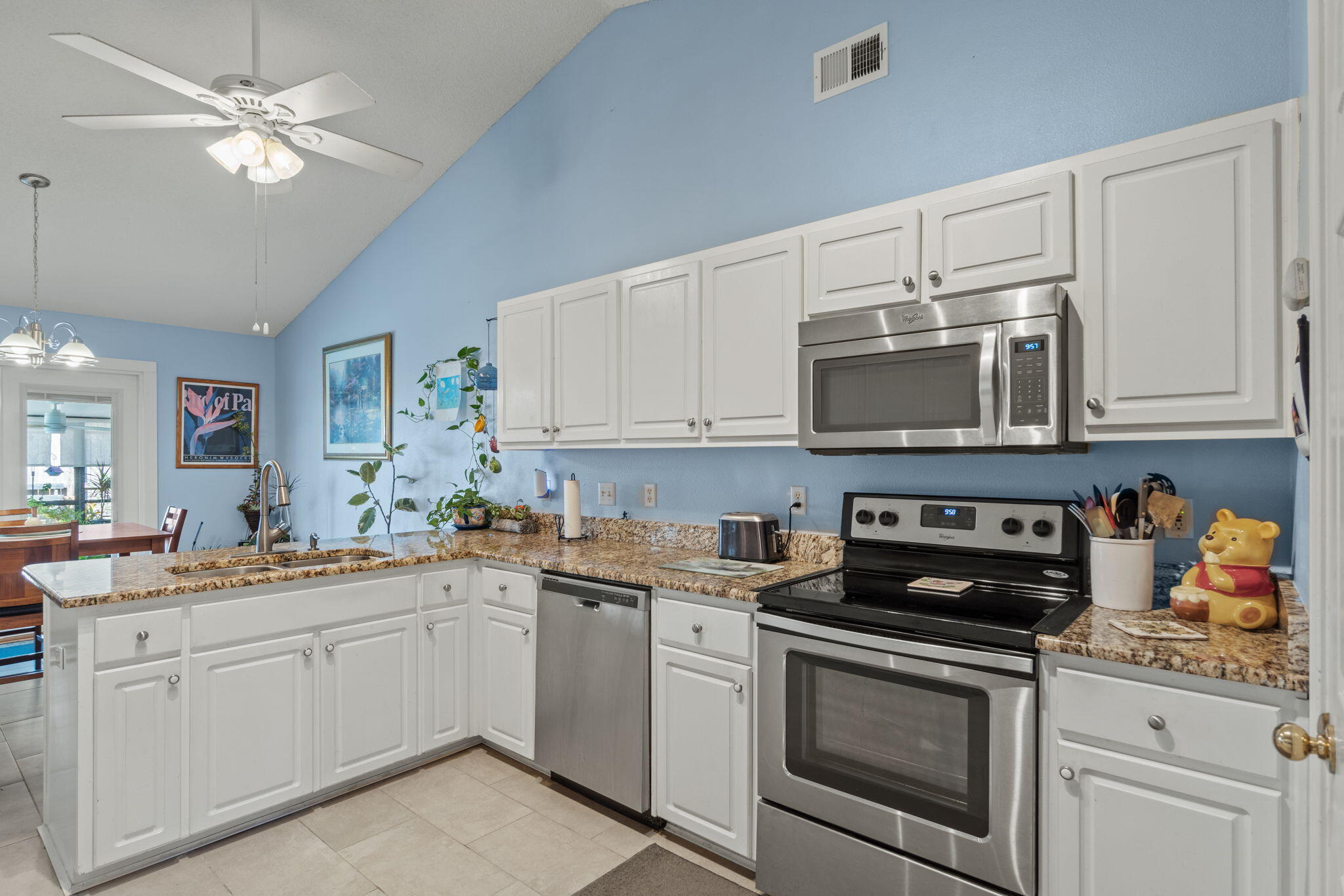 2121 Ortega Street Navarre, FL 32566 - Photo 15 of 47 a kitchen with a sink stove and microwave