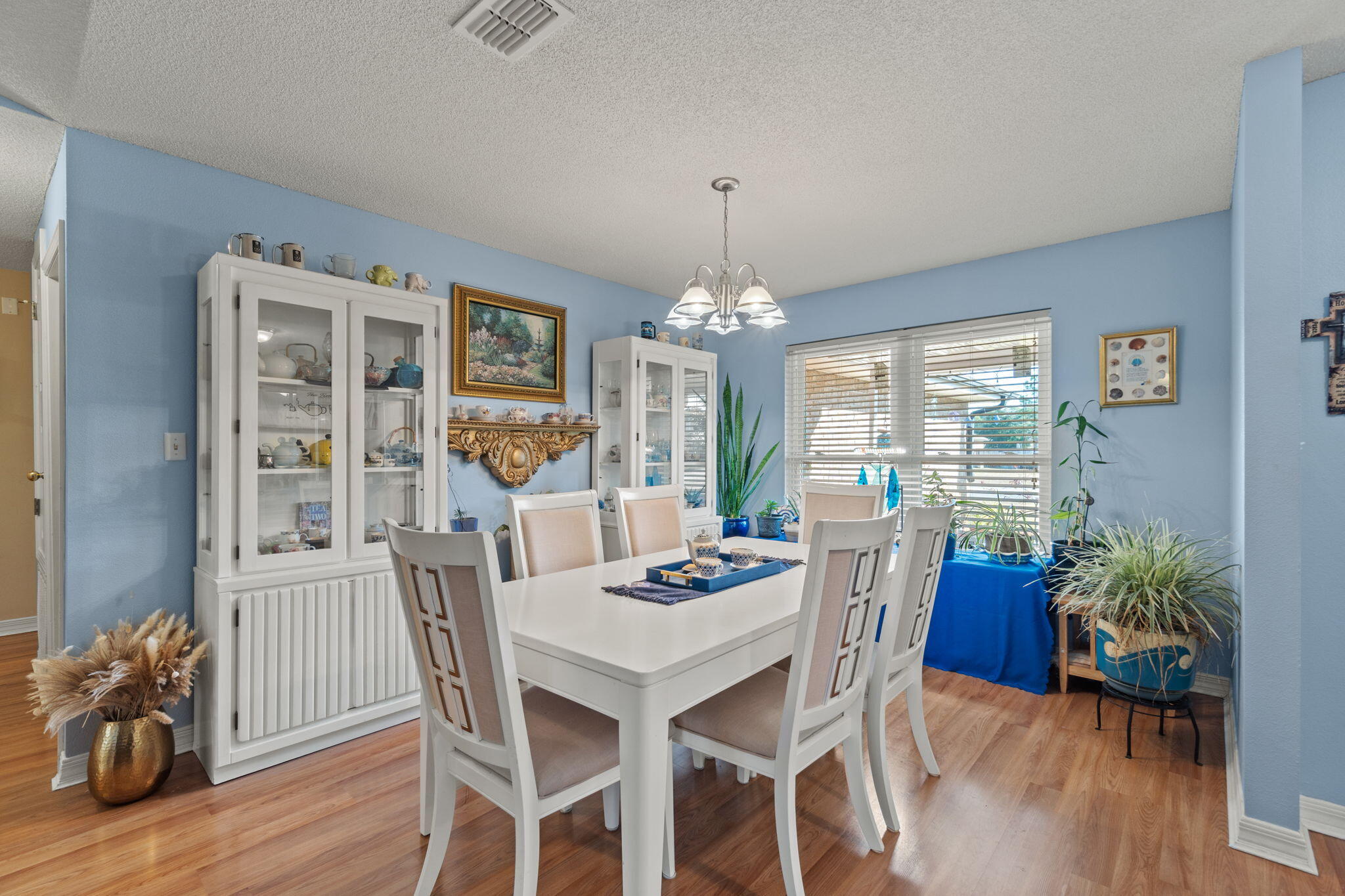 2121 Ortega Street Navarre, FL 32566 - Photo 16 of 47 a view of a dining room with furniture window and wooden floor