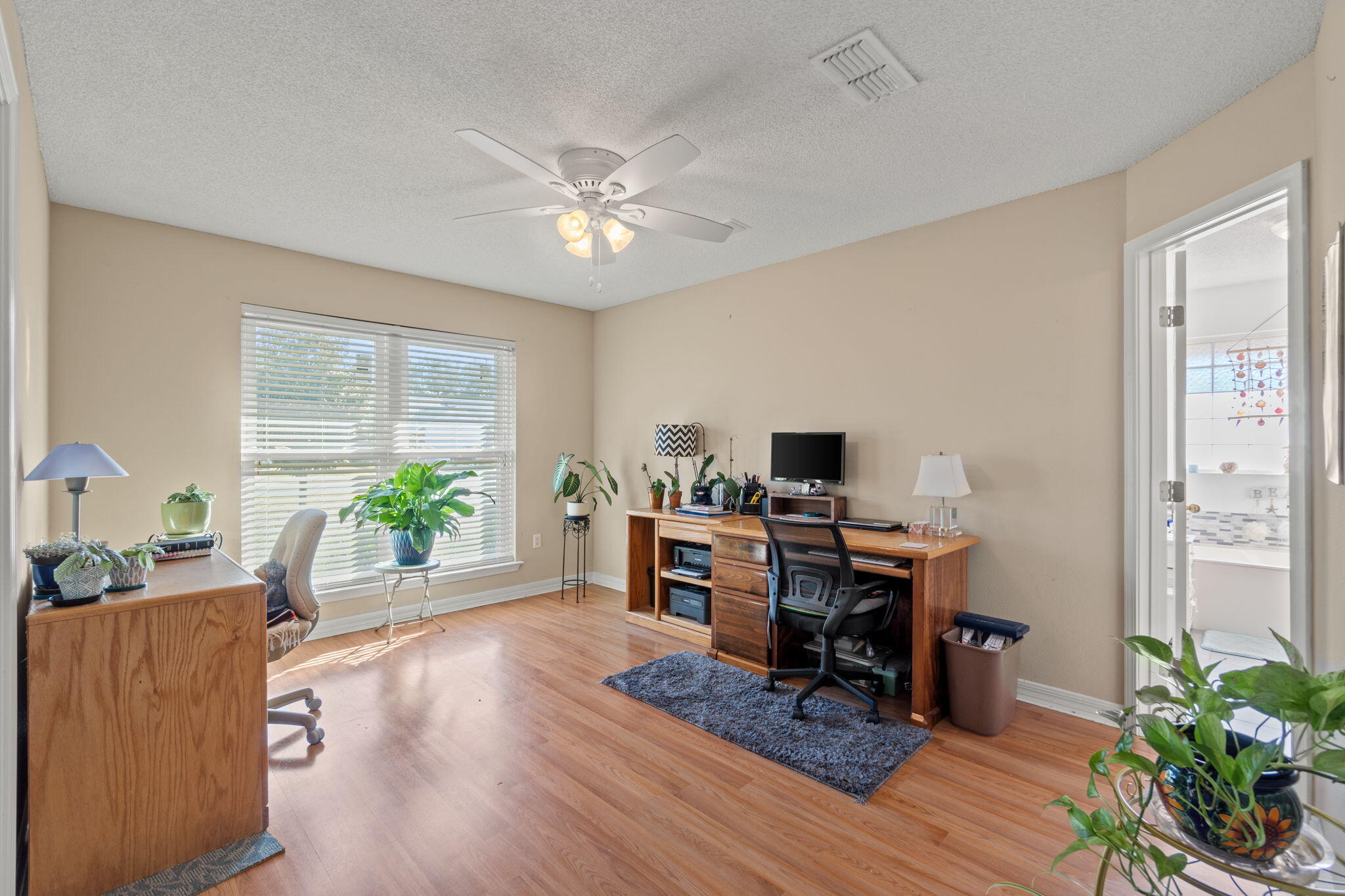 2121 Ortega Street Navarre, FL 32566 - Photo 17 of 47 a workspace with furniture and a window