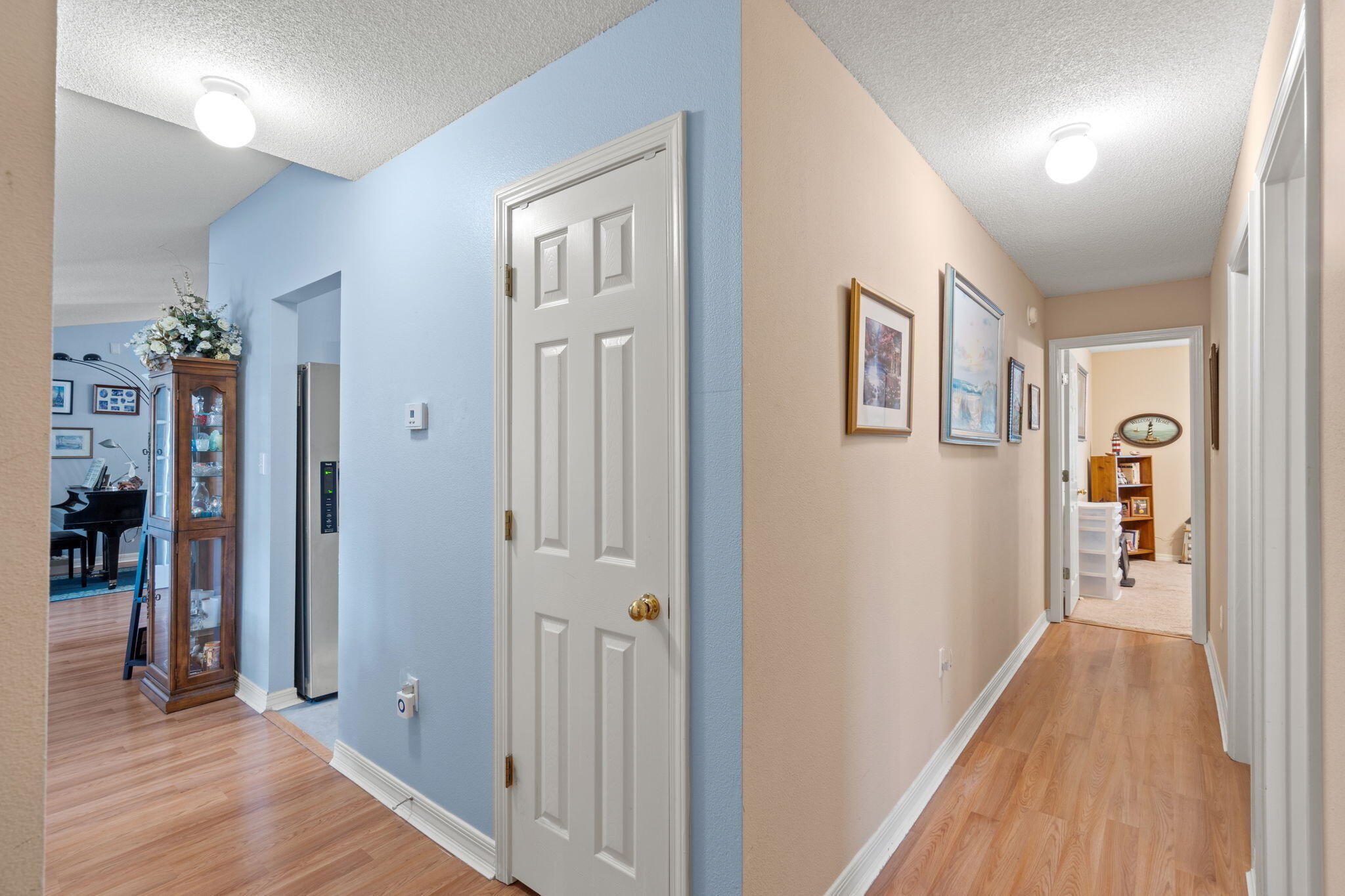 2121 Ortega Street Navarre, FL 32566 - Photo 24 of 47 a view of a hallway with wooden floor and entryway
