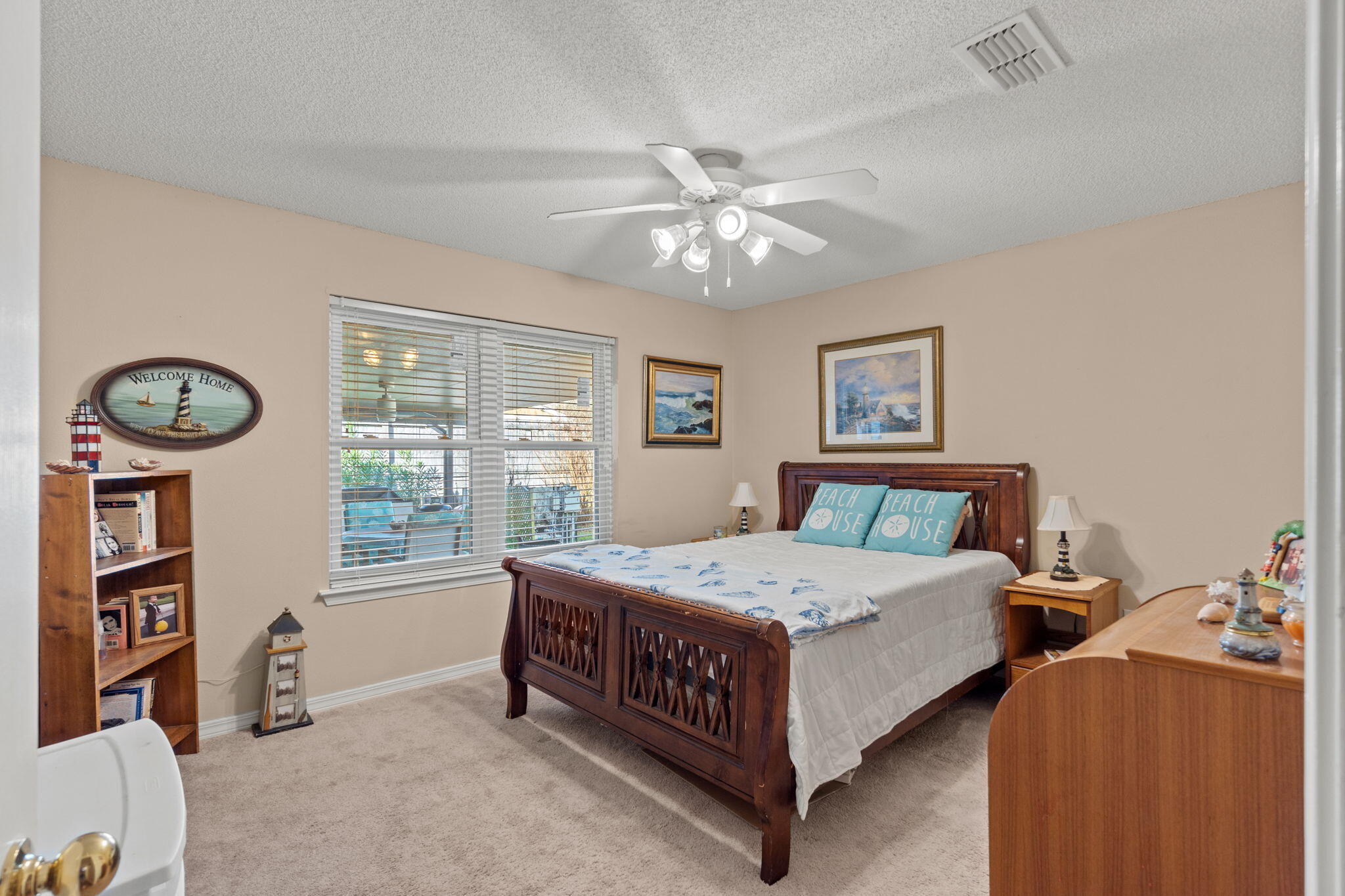 2121 Ortega Street Navarre, FL 32566 - Photo 25 of 47 a bedroom with a bed chandelier and a window