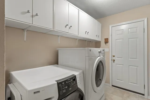 a view of a swimming pool with a lounge chairs