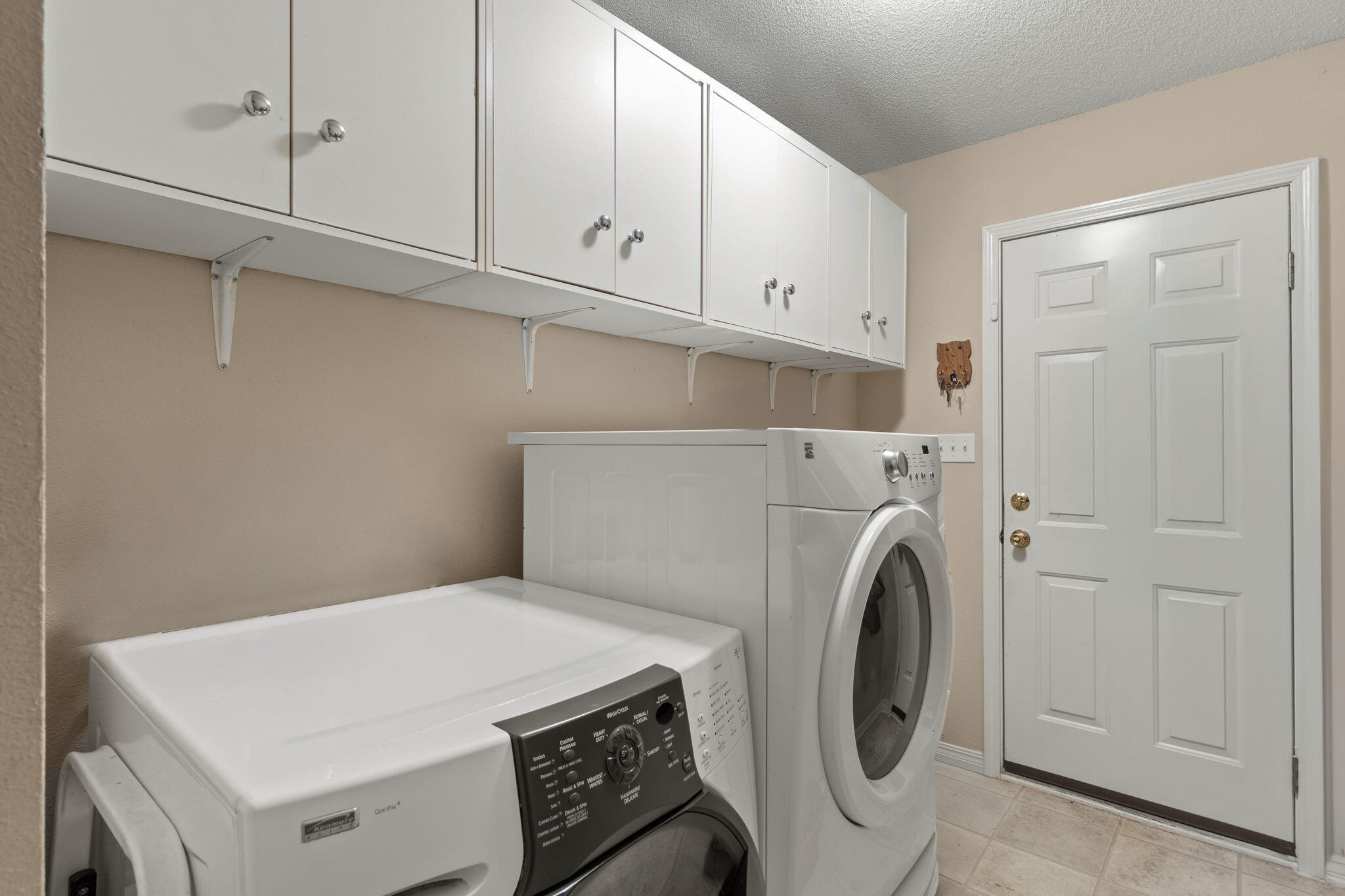 2121 Ortega Street Navarre, FL 32566 - Photo 31 of 47 a utility room with dryer and washer