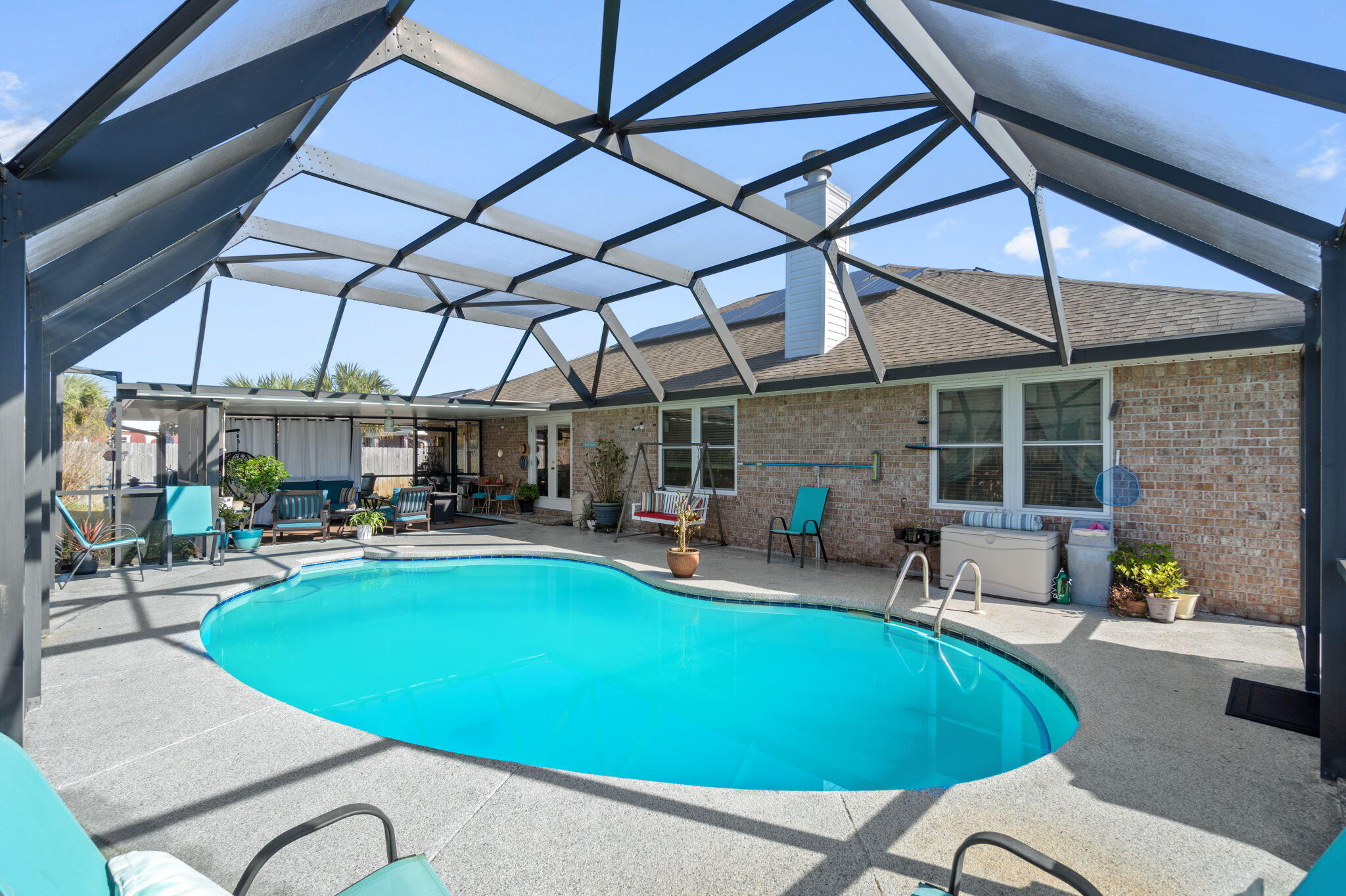 2121 Ortega Street Navarre, FL 32566 - Photo 33 of 47 a view of a swimming pool with a patio