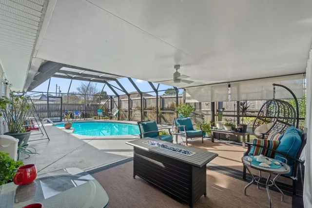a view of a house with backyard porch and sitting area