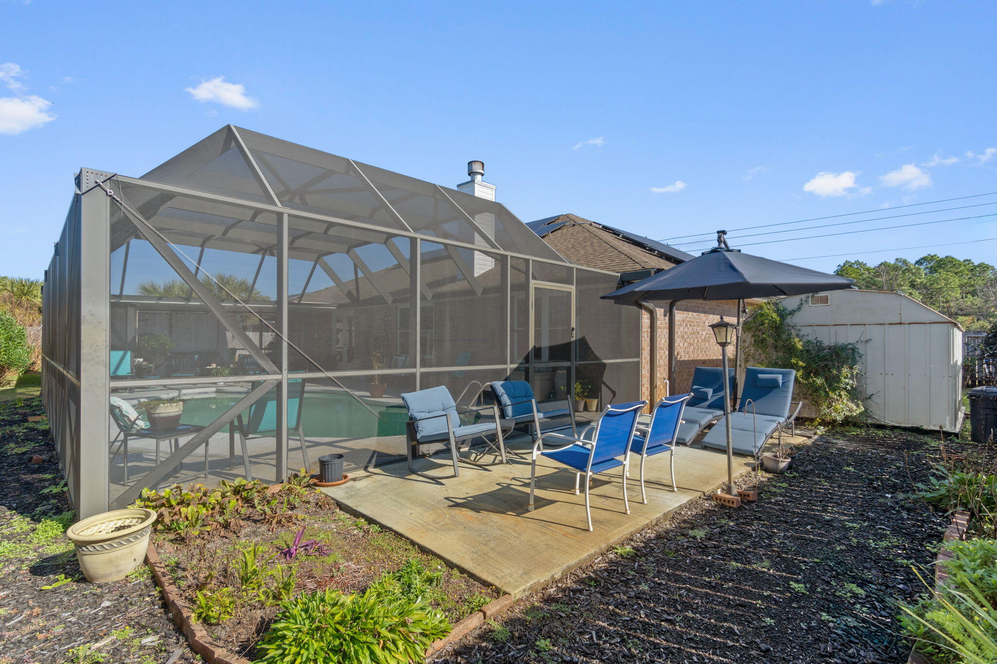 2121 Ortega Street Navarre, FL 32566 - Photo 37 of 47 a view of house with a big yard and potted plants