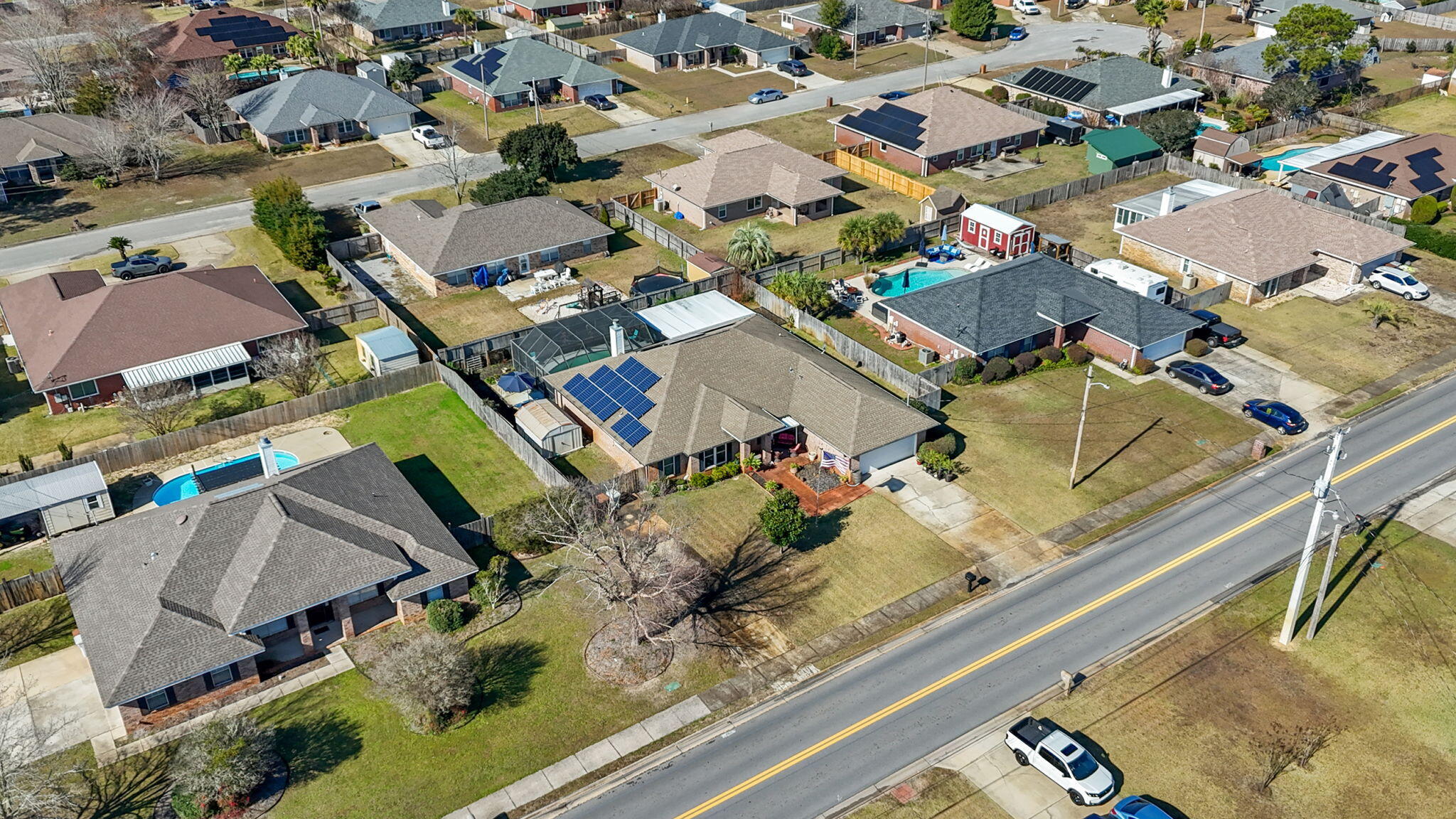 2121 Ortega Street Navarre, FL 32566 - Photo 39 of 47 an aerial view of residential houses with outdoor space