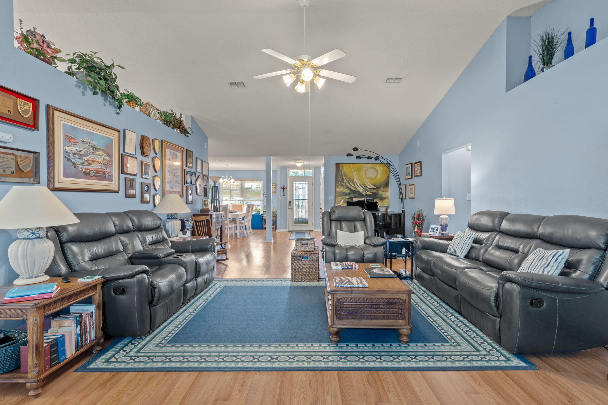 2121 Ortega Street Navarre, FL 32566 - Photo 9 of 47 a living room with furniture and a fireplace