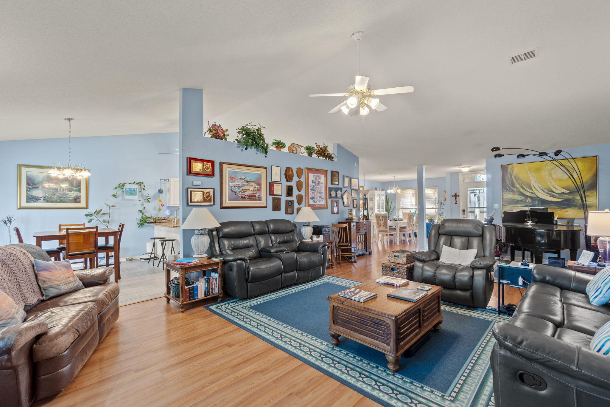 2121 Ortega Street Navarre, FL 32566 - Photo 10 of 47 a living room with furniture kitchen view and a chandelier