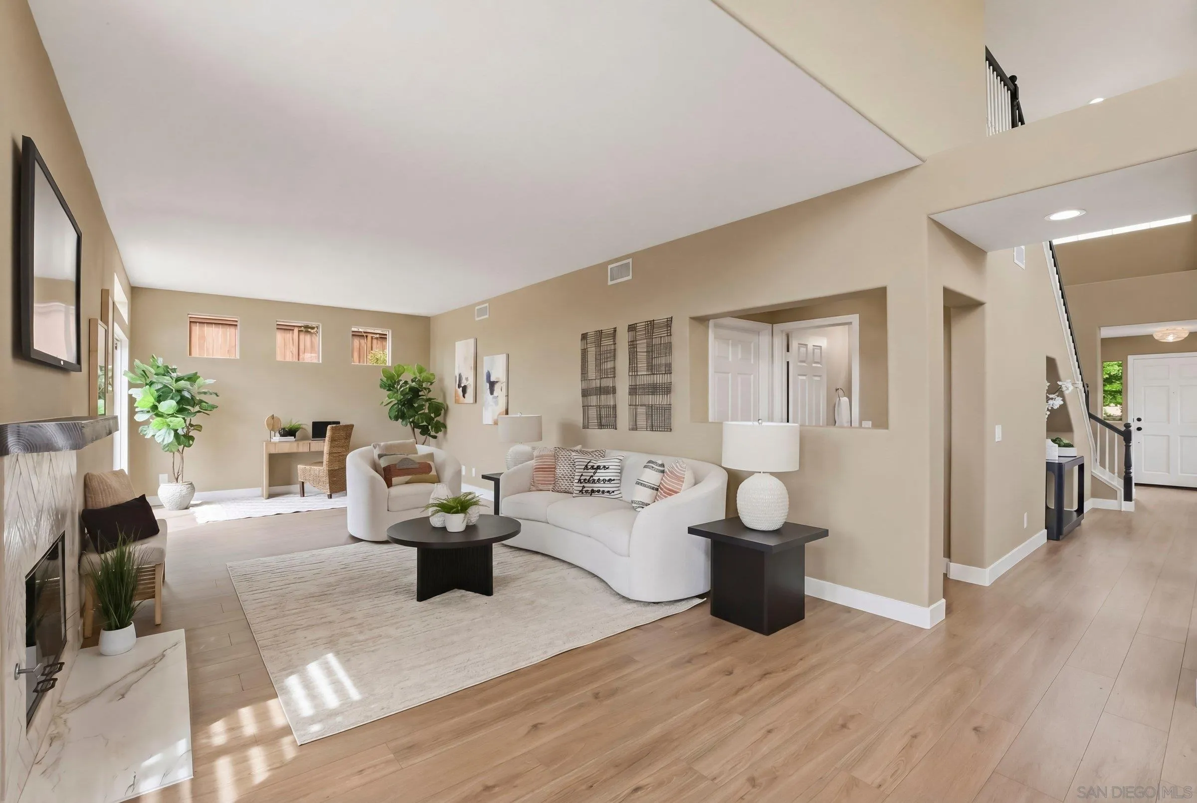 12182 Mannix Road San Diego, CA 92129 - Photo 12 of 43 a living room with furniture and wooden floor