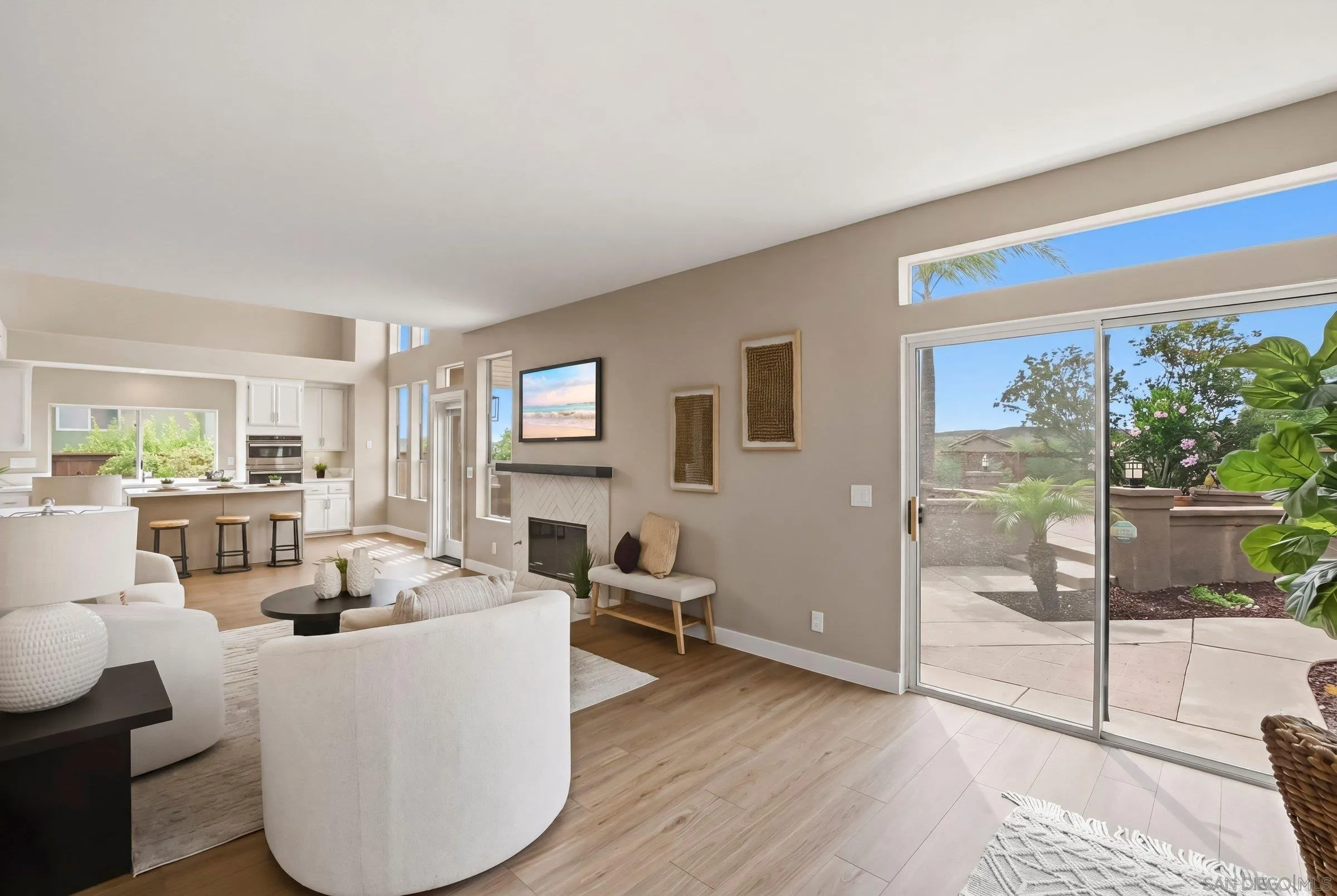 12182 Mannix Road San Diego, CA 92129 - Photo 13 of 43 a living room with furniture and a floor to ceiling window