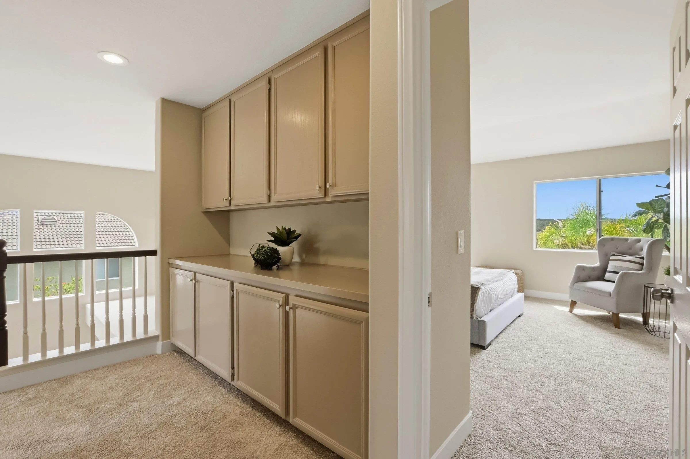 12182 Mannix Road San Diego, CA 92129 - Photo 21 of 43 a view of hallway with furniture and a window