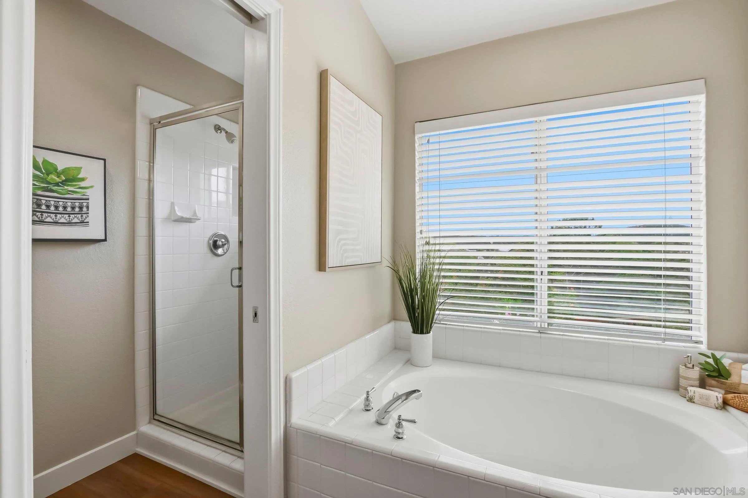 12182 Mannix Road San Diego, CA 92129 - Photo 26 of 43 a bathroom with a bathtub and a shower