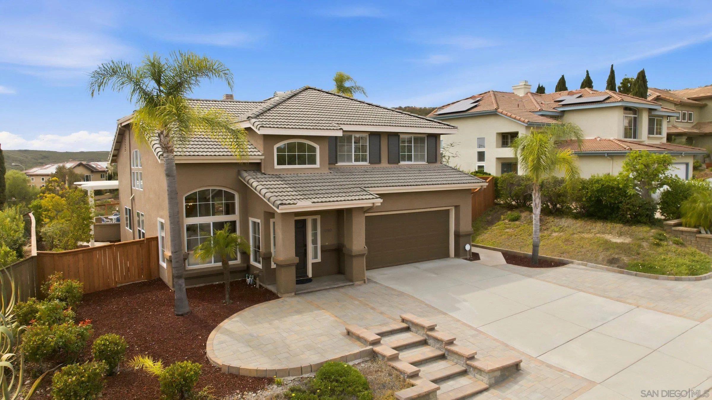 12182 Mannix Road San Diego, CA 92129 - Photo 38 of 43 a view of a house with a patio