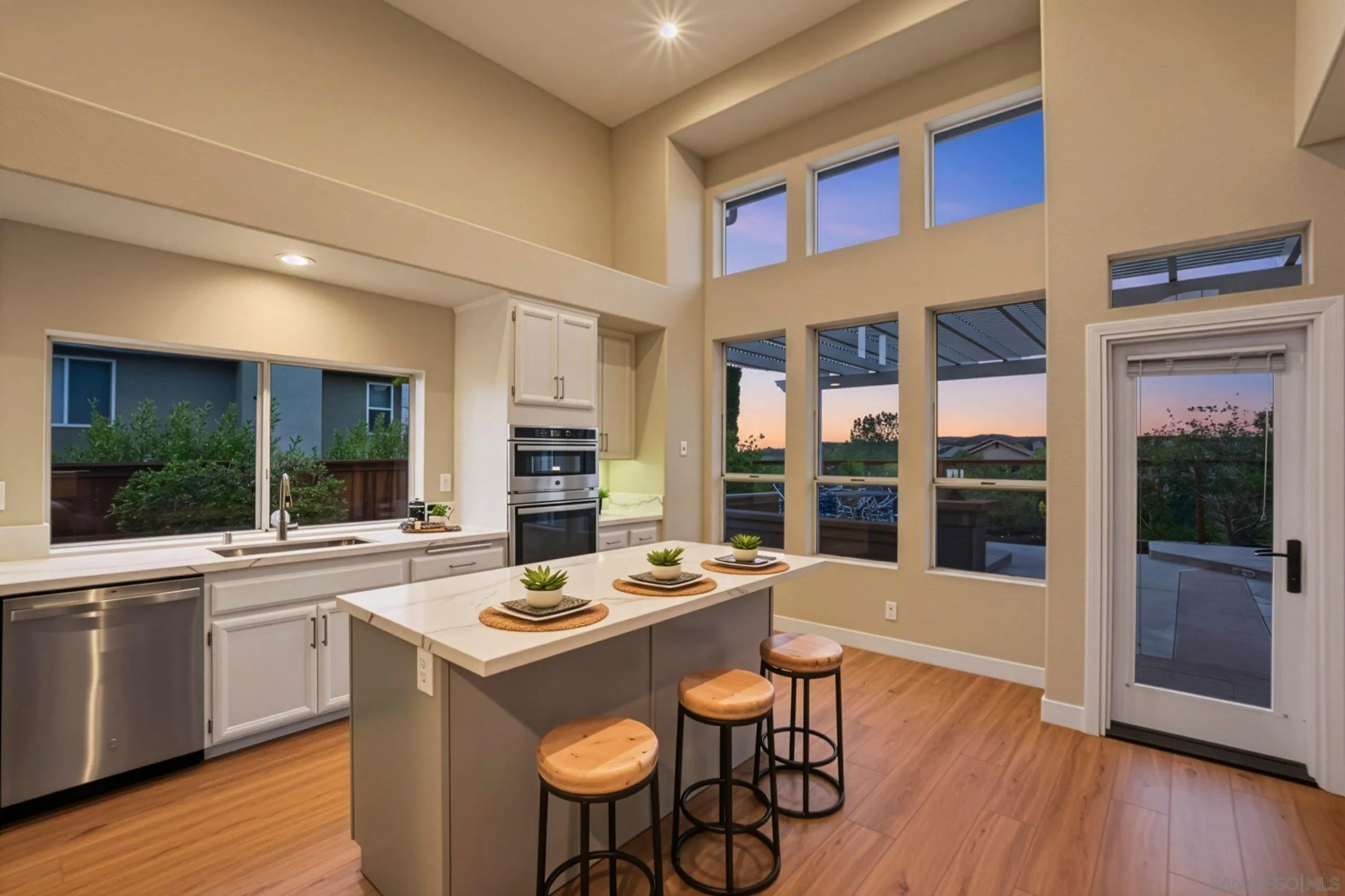 12182 Mannix Road San Diego, CA 92129 - Photo 5 of 43 a kitchen with a sink a counter top space and stainless steel appliances