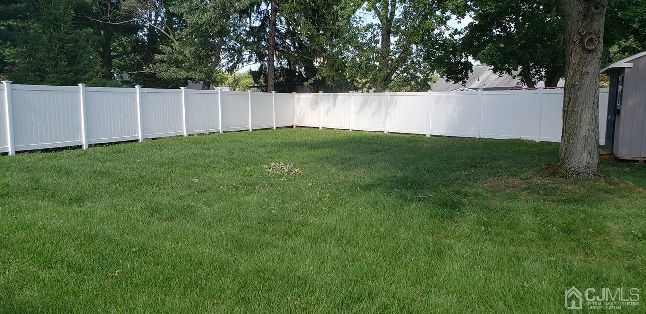 9 Richmond Road Edison, NJ 08817 - Photo 13 of 15 a view of a backyard with plants