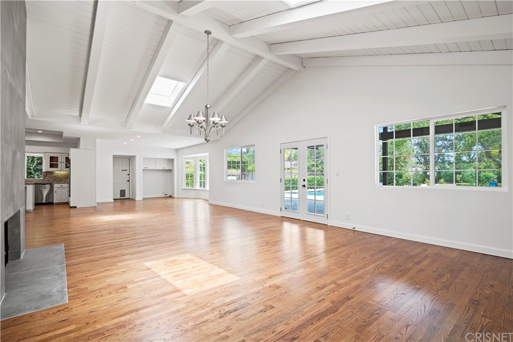 17220 Gresham Street Northridge, CA 91325 - Photo 17 of 57 an empty room with wooden floor and windows