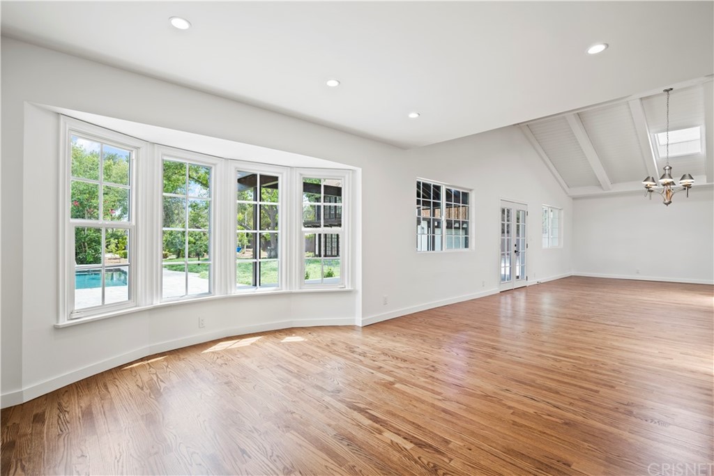 17220 Gresham Street Northridge, CA 91325 - Photo 18 of 57 a view of empty room with wooden floor and fan