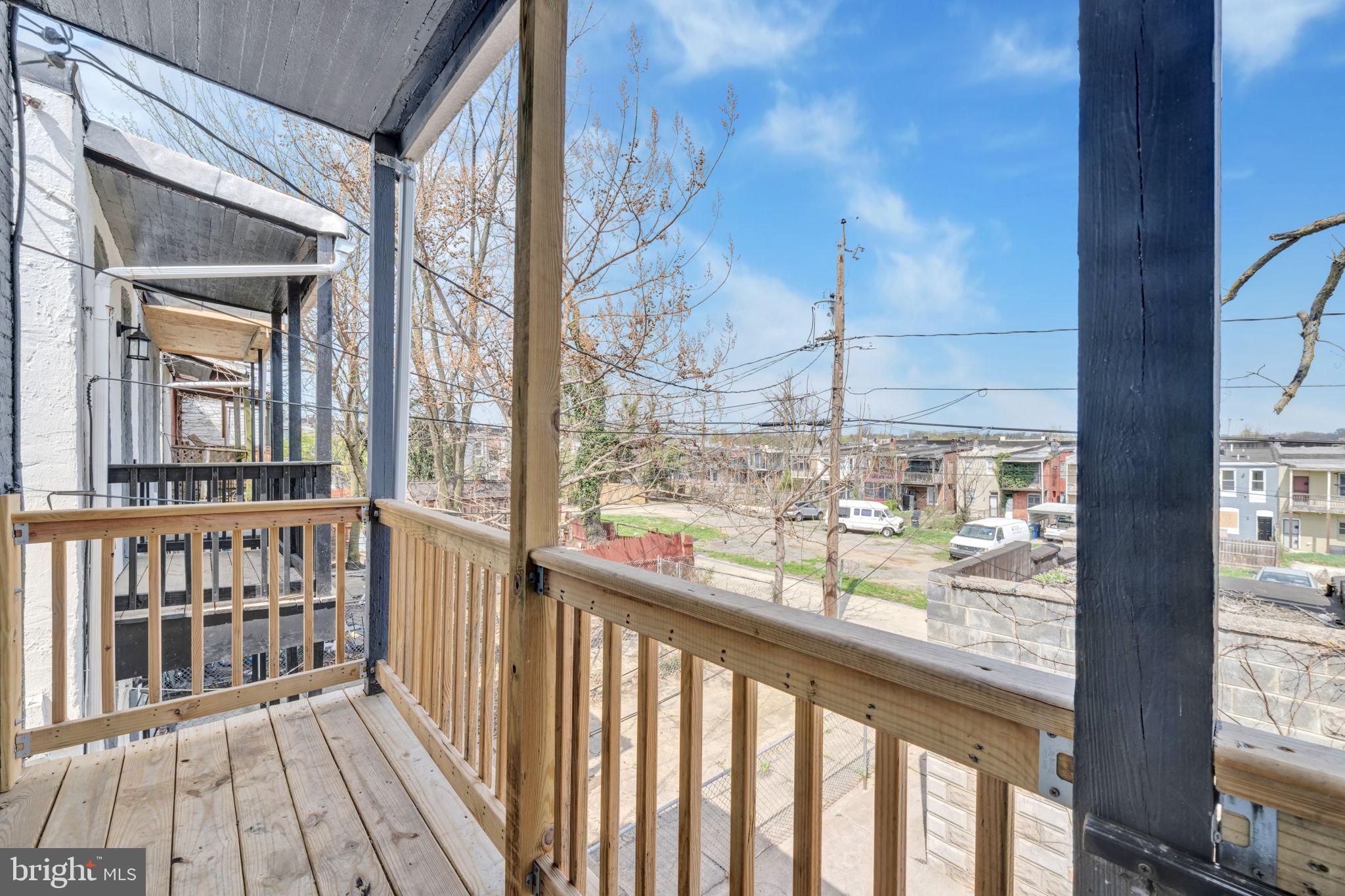 2822 Riggs Avenue Baltimore, MD 21216 - Photo 24 of 30 a view of a balcony with wooden floor